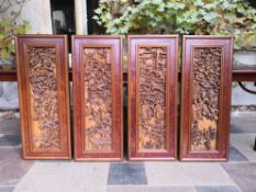 A set of four Chinese carved hardwood hanging wall panels. 107x42cm.