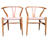 A pair of Hans Wegner for Carl Hansen model CH24 Wishbone chairs with cord seats on ash frames,