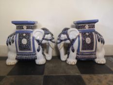 A pair of glazed ceramic elephant garden seats. H.43 W.48cm.