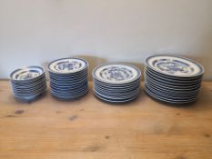 A collection of Chinese blue and white plates, to include twelve dinner plates, bowls, side plates