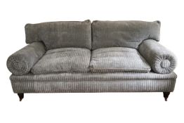 A contemporary George Smith 19th century style two seater sofa on turned tapering mahogany supports.