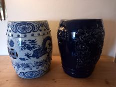 A Chinese ceramic blue and white garden seat along with a blue glazed example. H.44cm.