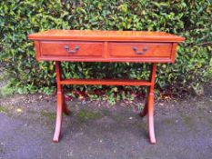 A Chinese hardwood side or writing table with two frieze drawers on stretchered swept supports. H.78