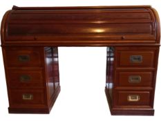 A Chinese three section hardwood cylinder top bureau with fitted interior above pedestal drawers.