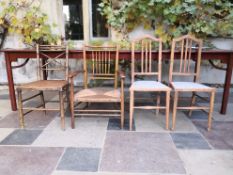 A pair of Edwardian bedroom chairs, a late 19th century rush seated armchair and a Regency painted