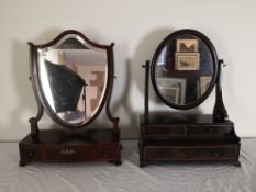 A 19th century mahogany shield shaped toilet mirror fitted with base drawers and a Chinese