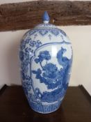 A large Chinese blue and white lidded jar of baluster form. H.59cm.