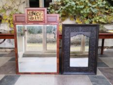 A Chinese teak framed mirror with gilt carved pediment and bevelled plate and a carved hardwood