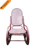 A late 19th century bentwood rocking chair in the Thonet style. H.105cm. (Damage to canework as