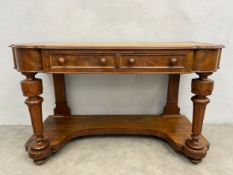 A late 19th century walnut console table having a gilt and tooled leather top with lobed corners
