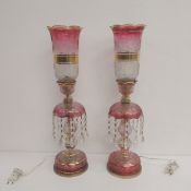 A pair of vintage Bohemian pink and gilt cut glass table lamps with lustre drops raised on