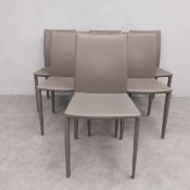 A set of six modern dining chairs in faux leather. Seat height 47cm. Back 90cm.
