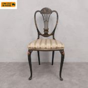 A 20th century black lacquered Chinoiserie hall chair having a shaped back with hand painted figural