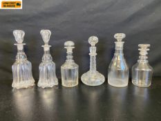 Six 19th century and later cut glass decanters to include a pair of Victorian bell decanters,