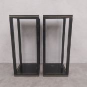 A pair of vintage black painted metal side tables each having a square black glass inset top