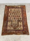 A Caucasian Daghestan prayer rug with an allover geometric boteh pattern and directional mihrab in