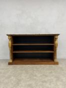 A Regency rosewood open bookcase with marble top over three shelves flanked by a pair of carved