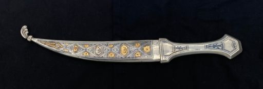 A late 19th/early 20th century niello and yellow metal inlaid white metal Persian or Iraqi Marsh