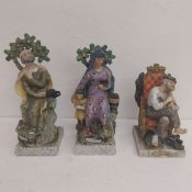 A pair of hand painted porcelain figures depicting Elijah and Widow along with a continental
