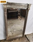 A 19th century break-fronted pier mirror with gilt fluted frieze and barley-twist columns flanking