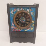 A C.1900 Aesthetic style black slate mantle clock with an engraved and gilt brass mounted dial in