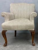 An early 20th century George I style armchair reupholstered in herringbone Andrew Martin fabric on