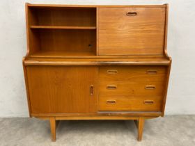 A mid-century teak side cabinet with pull out slide. H.111 W.107 D.38cm. (Small cut to back as