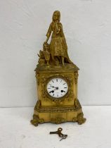 A 19th century French ormolu mantel clock with figural Arab girl cresting over the enamelled dial in