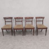 A set of four Regency mahogany barback dining chairs with chenille upholstered drop-in seats