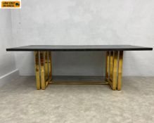 A large contemporary 'Lennox' dining table in the Hollywood Regency style with ebonised ash top
