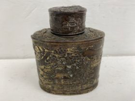A 19th century silver plated Chinese tea caddy decorated with willow pattern scenes of figures on
