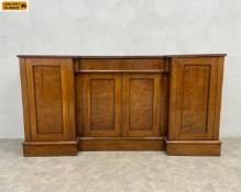 A 19th century mahogany breakfront sideboard with single fitted frieze drawer over four panelled