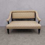 An Edwardian ebonised sofa reupholstered in foliate damask on turned tapering supports. H.86 Seat