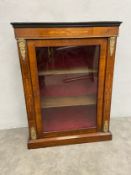 A Victorian walnut pier cabinet with ebonised top over the marquetry inlaid frieze and glazed