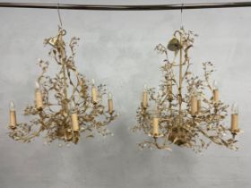 A pair of 19th century French wrought and painted metal chandeliers each with allover scrolling