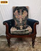 A William IV mahogany framed library armchair with needlework tapestry back and seat and scrolled