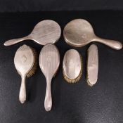 A mixed collection of C.1900 silver hallmarked vanity brushes and mirrors.