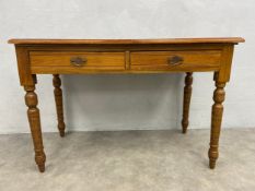 A 19th century walnut writing or side table fitted with frieze drawers on turned tapering