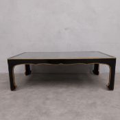 A C.1900 Chinese black lacquered coffee table with gilt grape and vine patterned top under