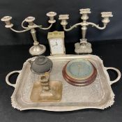 A mixed lot to include a pair of silver plated candelabras together with a tray, carriage clock,