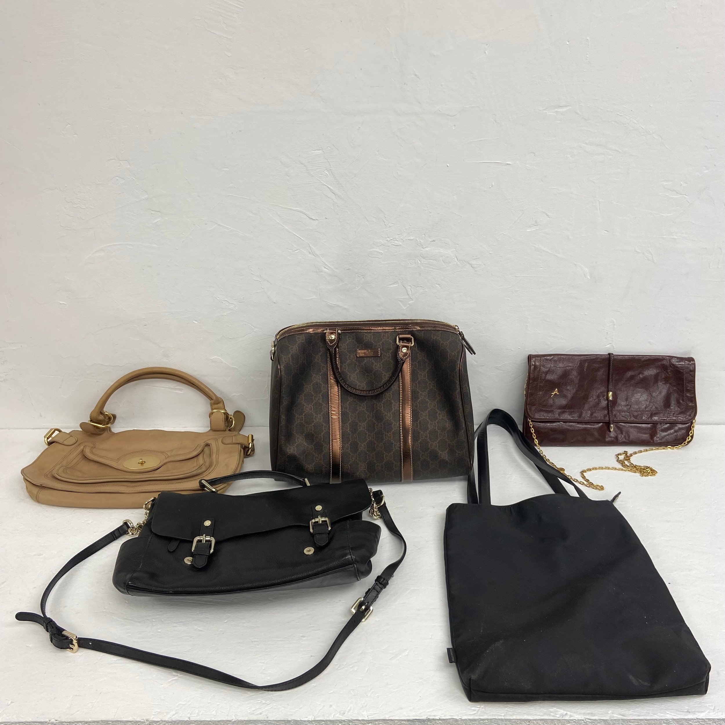 Five ladies' leather and other designer handbags to include a Gucci Boston Bag, Aquascutum,