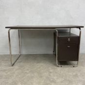 A vintage Zanotta Comacina style desk with brown faux leather top over a floating filing pedestal