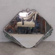 An early 20th century Art Deco wall mirror with geometric cresting over the bevelled diamond plate
