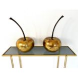 A pair of decorative composite cherries in a gold lacquered finish. H.46cm.
