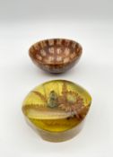 A possibly 19th century Chinese carved stone tea bowl inlaid allover with auspicious characters