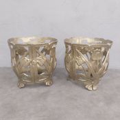 A pair of vintage gold painted cast iron openwork planter or pot stands with stylised tulip designs.
