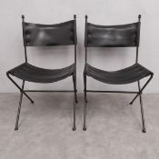 A pair of mid-century Spanish style wrought iron and black hide leather chairs. H.92 W.52 D.40cm