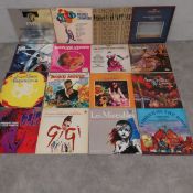 A mixed collection of seventy-four vintage vinyl LP records to include Hair, Santana, John Lennon,
