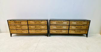 A pair of black metal framed desk tidies or filing or trinket chests with gold painted drawers.