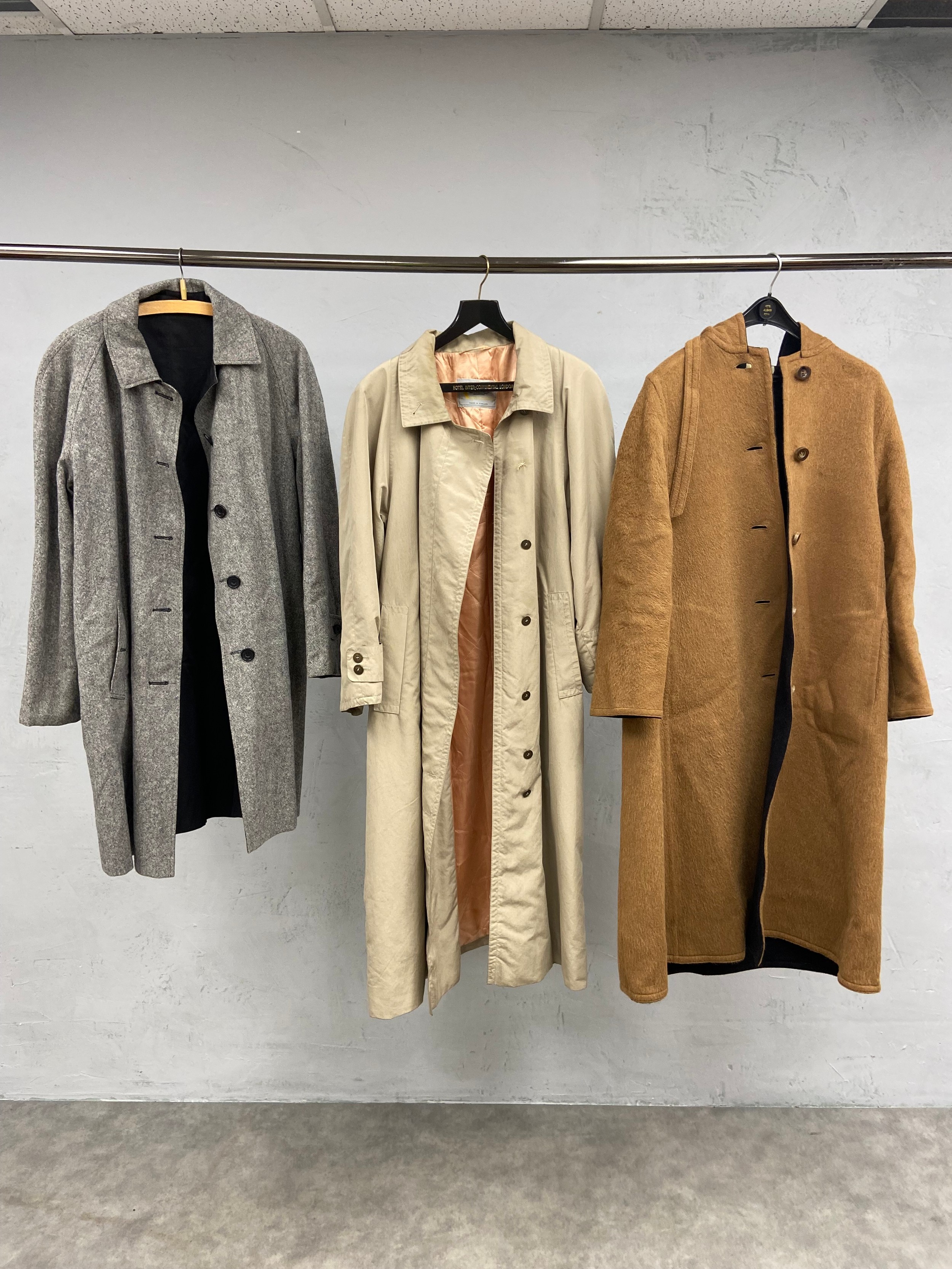 Three vintage ladies' wool and alpaca Aquascutum coats. H.125cm. (Largest)